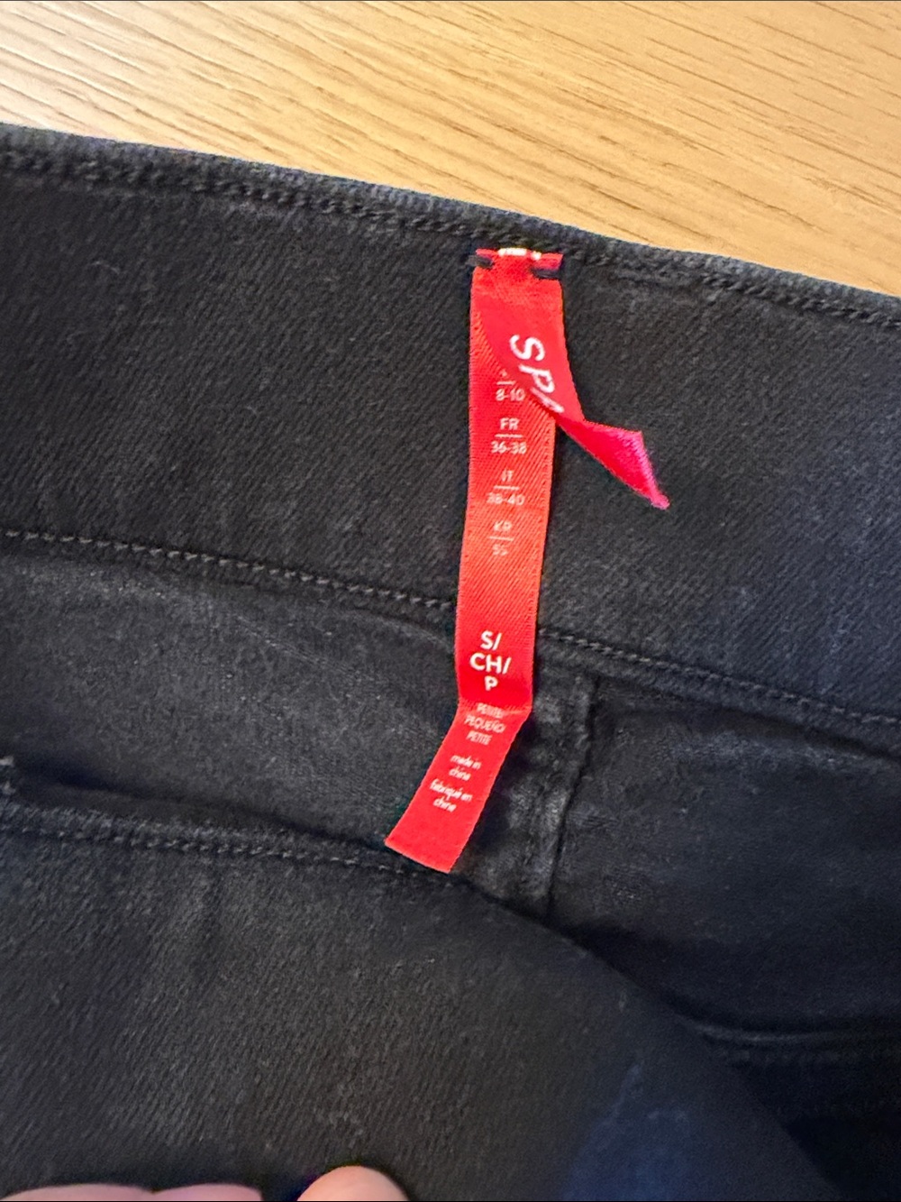 SPANX High-Rise Pull-On Flare Jeans in Black - Picture 5 of 8